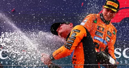 SPIELBERG, AUSTRIA - JUNE 29: Race winner Lando Norris of Great Britain and McLaren on the podium with his trophy and Champagne during the F1 Grand Prix of Austria at Red Bull Ring on June 29, 2025 in Spielberg, Austria. (Photo by Joe Portlock/Getty Images)