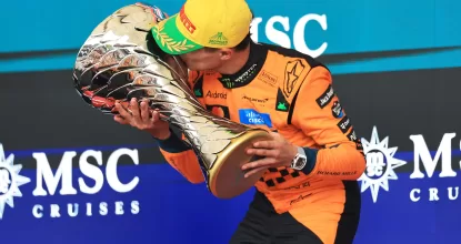 SAO PAULO, BRAZIL - NOVEMBER 09: Race winner Lando Norris of Great Britain and McLaren kisses his trophy on the podium during the F1 Grand Prix of Brazil at Autodromo Jose Carlos Pace on November 09, 2025 in Sao Paulo, Brazil. (Photo by Buda Mendes/Getty Images)