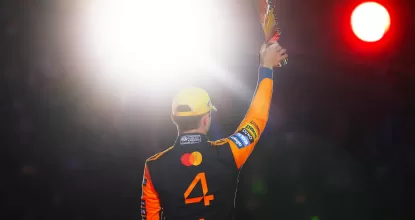 LAS VEGAS, NEVADA - NOVEMBER 22: Second placed Lando Norris of Great Britain and McLaren lifts his trophy on the podium during the F1 Grand Prix of Las Vegas at Las Vegas Strip Circuit on November 22, 2025 in Las Vegas, Nevada. (Photo by Mark Thompson/Getty Images)