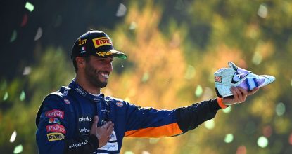 Daniel-ricciardo-holds-out-his-shoe-after-winning-the-2021-italian-Grand-Prix-at-monza