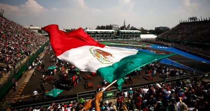 MEXICO CITY, MEXICO - OCTOBER 29: Sergio Perez of Mexico driving the (11) Oracle Red Bull Racing RB18 passes a fan waving a Mexico flag during qualifying ahead of the F1 Grand Prix of Mexico at Autodromo Hermanos Rodriguez on October 29, 2022 in Mexico City, Mexico. (Photo by Chris Graythen/Getty Images) // Getty Images / Red Bull Content Pool // SI202210290815 // Usage for editorial use only //
