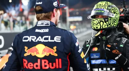ABU DHABI, UNITED ARAB EMIRATES - DECEMBER 07: Race winner Max Verstappen of the Netherlands and Oracle Red Bull Racing congratulates 2025 F1 World Drivers Champion and Third placed Lando Norris of Great Britain and McLaren in parc ferme during the F1 Grand Prix of Abu Dhabi at Yas Marina Circuit on December 07, 2025 in Abu Dhabi, United Arab Emirates. (Photo by Mark Thompson/Getty Images) // Getty Images / Red Bull Content Pool // SI202512080177 // Usage for editorial use only //